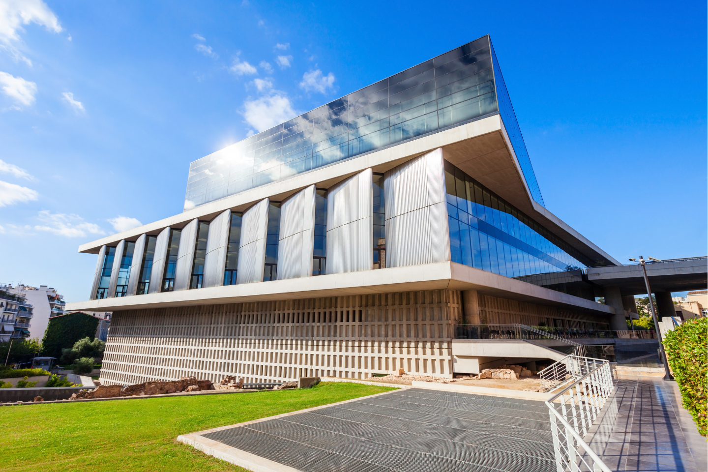 Acropolis Museum in Athens under a bright blue sky