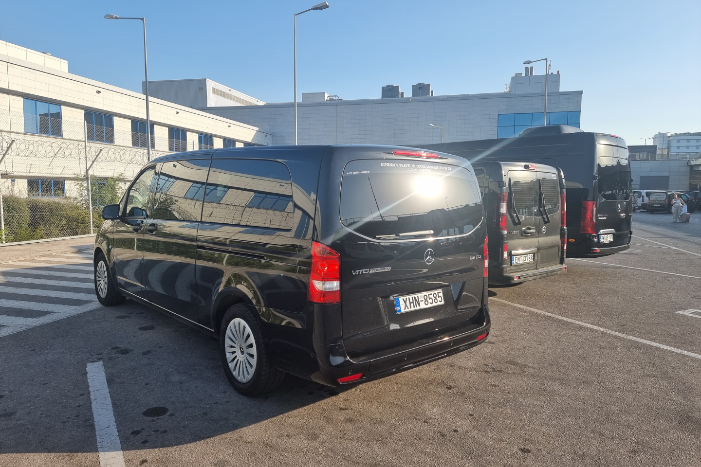 Athenaos Mercedes vans parked at the Athens Airport ready for private transfers.