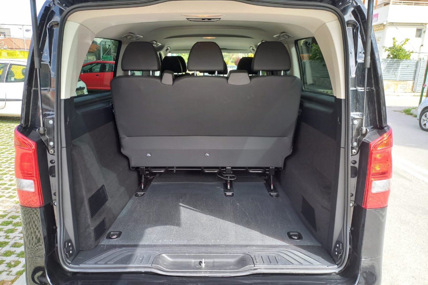 Spacious luggage area inside an Athenaos Travel Mercedes van