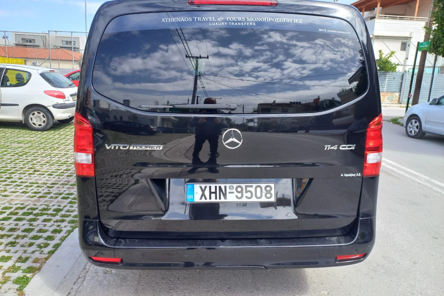Rear view of an Athenaos black Mercedes van used for private transfers in Athens.