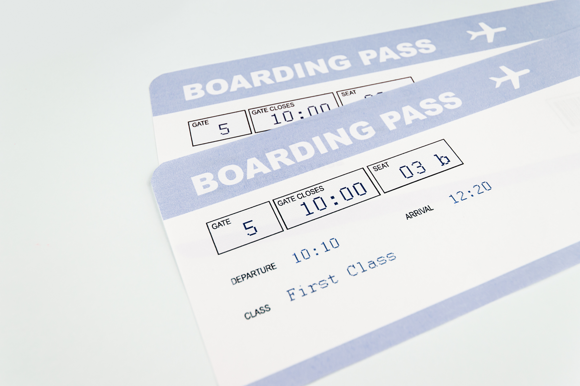 Two airplane boarding passes on a desk representing travel tickets booking with Athenaos.