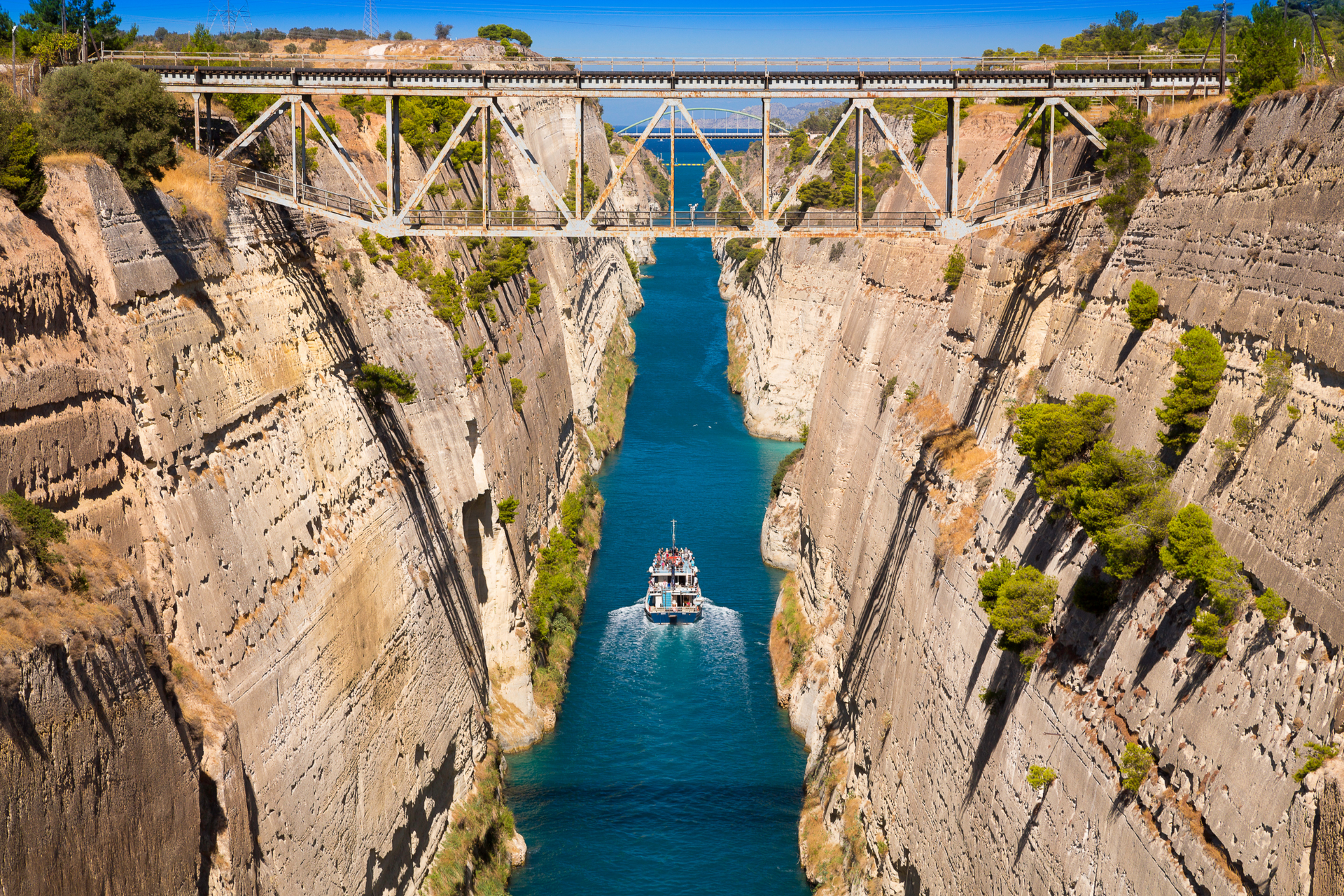 Corinth Canal aerial view with turquoise water and steep rock walls