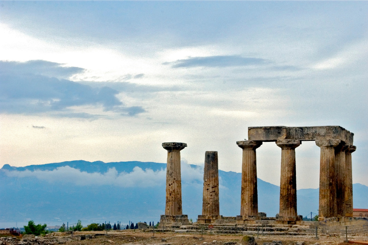 Temple columns at Ancient Corinth with scenic landscape in the background