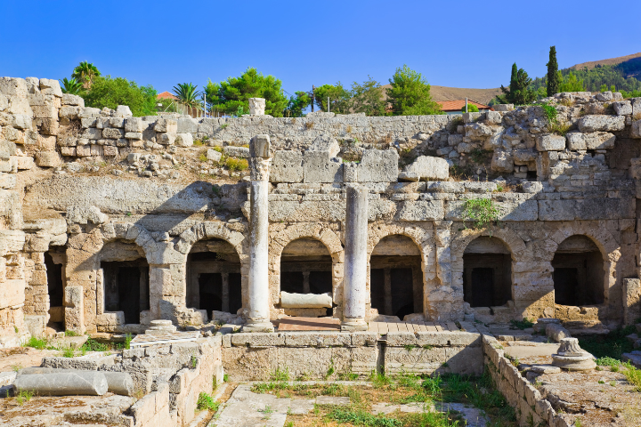 Roman ruins and stone arches at Ancient Corinth archaeological site