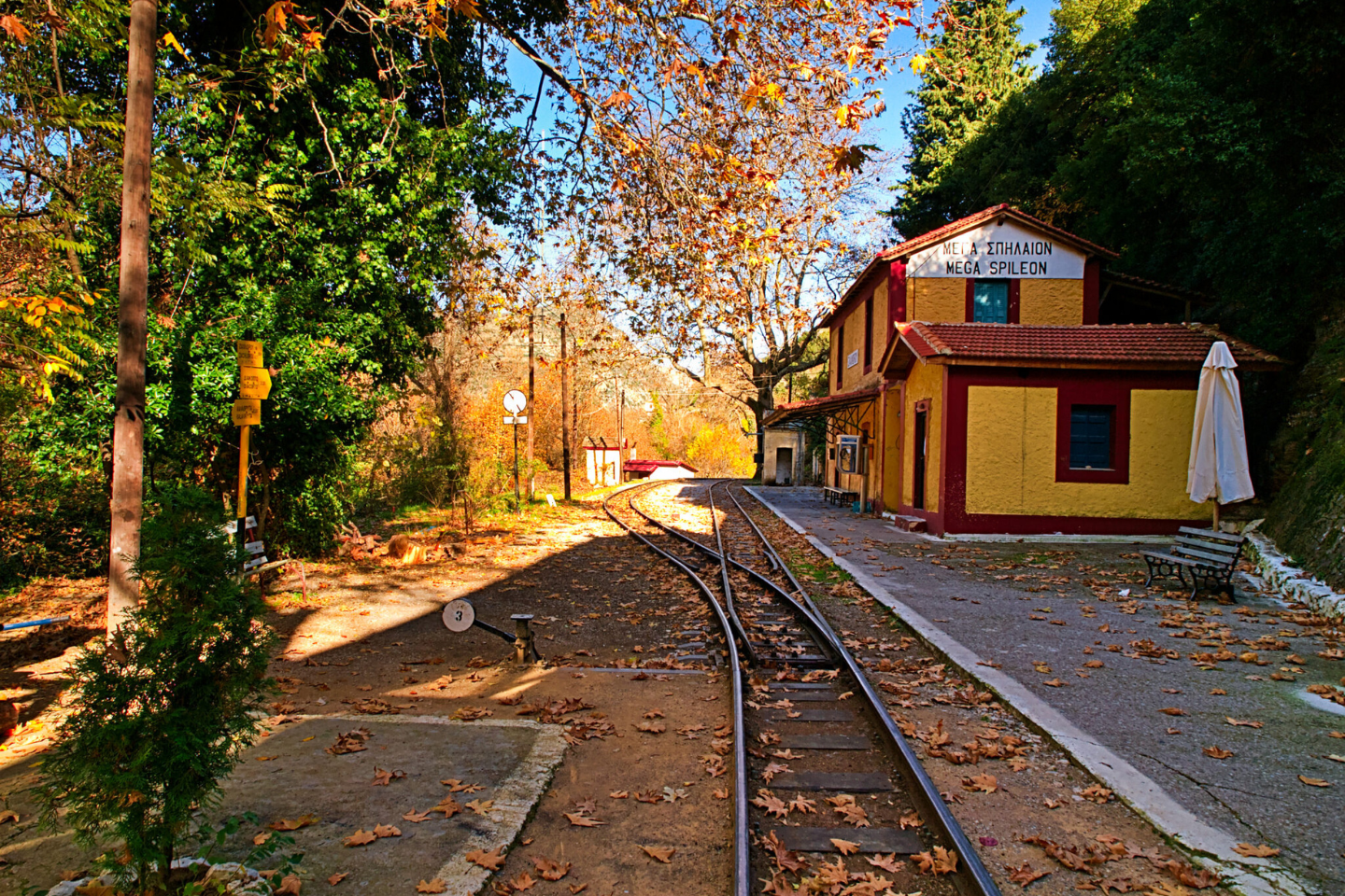Railway station of Zachlorou village surrounded by autumn trees