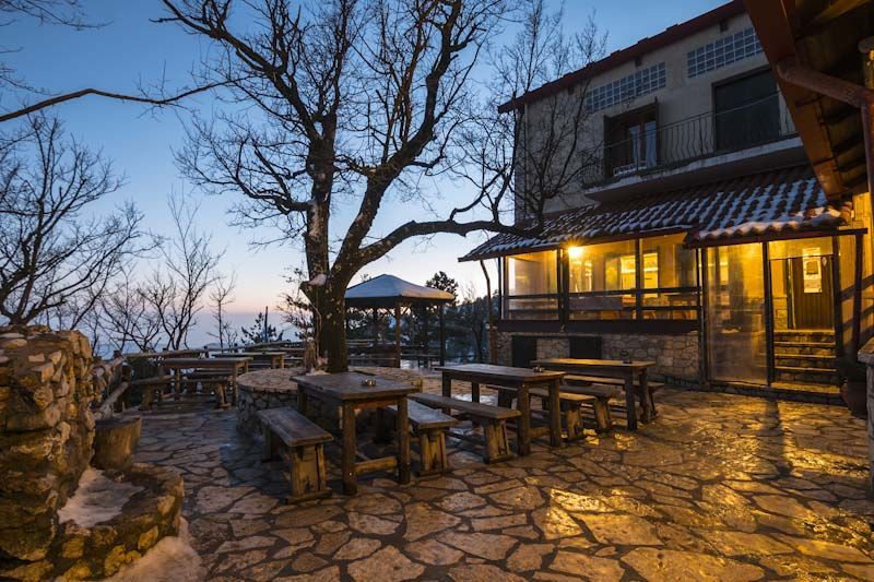 Bafi Refuge mountain hut on Mount Parnitha at sunset