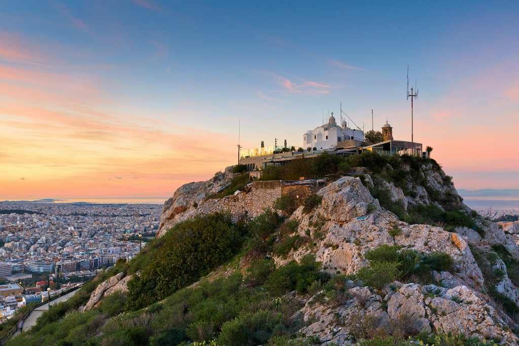 Mount Lycabettus hilltop with Saint George Chapel and Athens city view