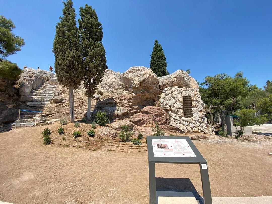Areopagus Hill in Athens with ancient rock formations and information sign
