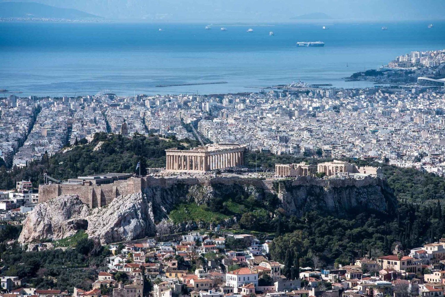 Panoramic view of Athens city and the Acropolis with the sea in the background