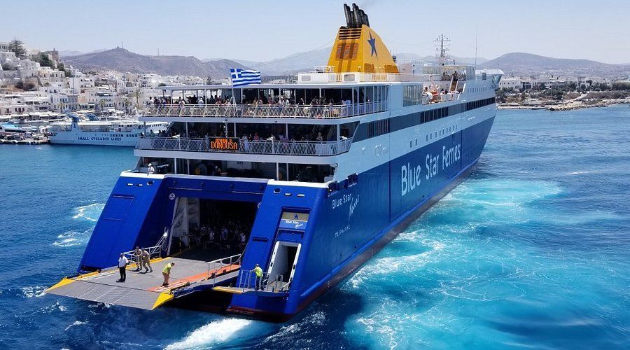Blue Star Ferry departing from a Greek island port, representing domestic ferry routes and island connections with Athenaos.