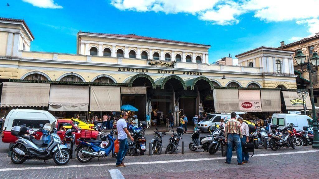 Entrance of Varvakeios Central Market with locals and vendors