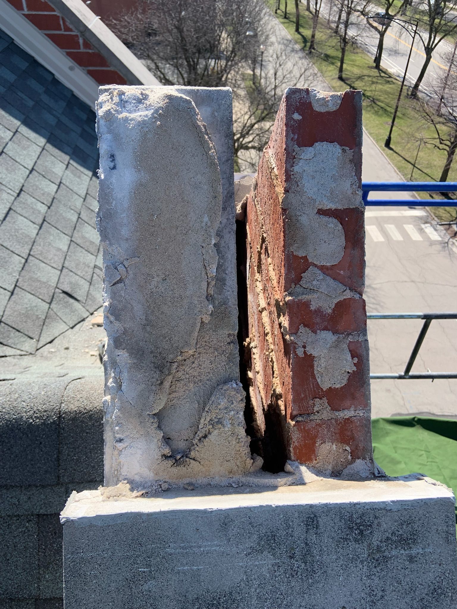 Cracked rooftop brick parapet wall
