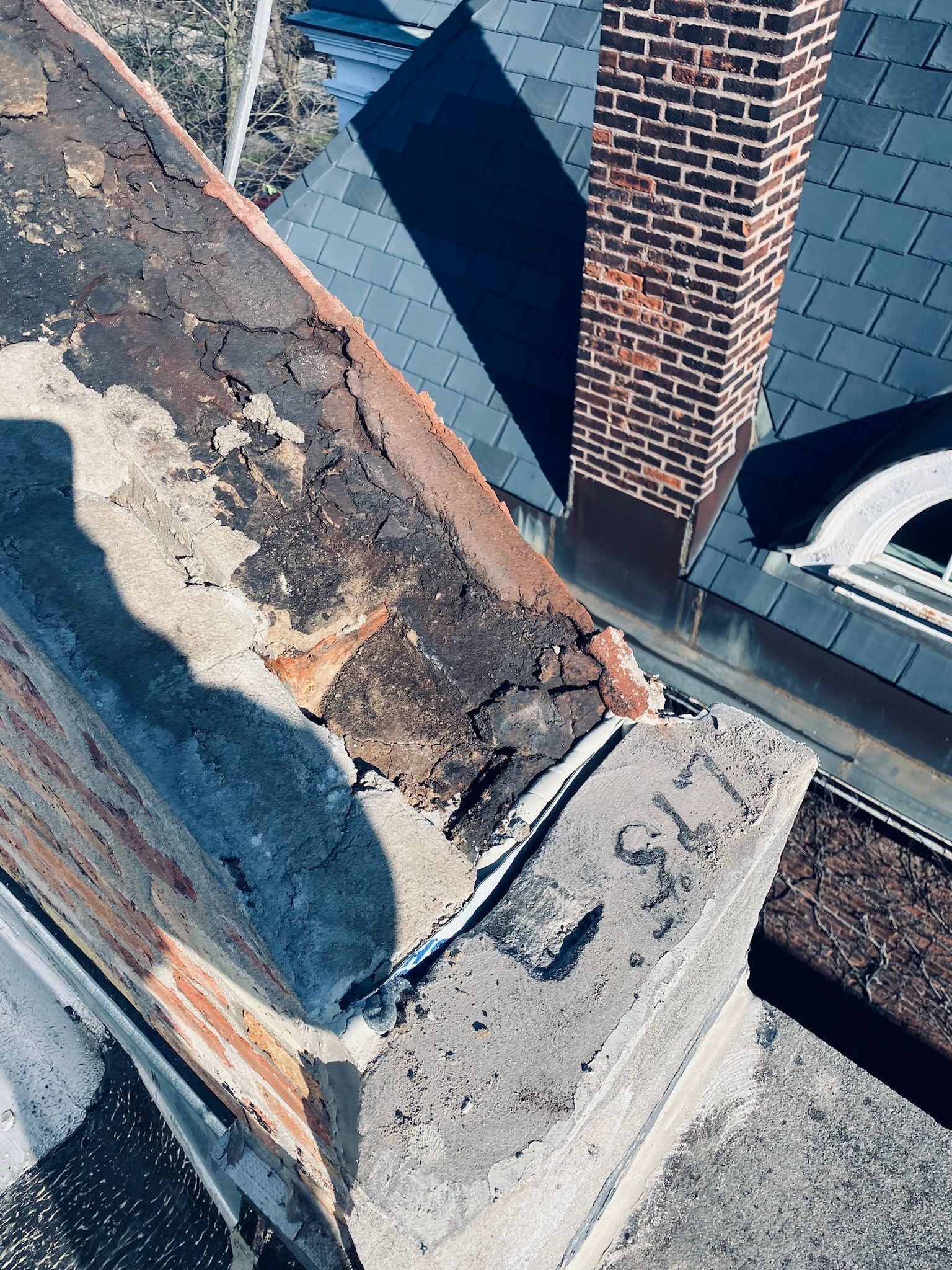 Damaged rooftop parapet flashing