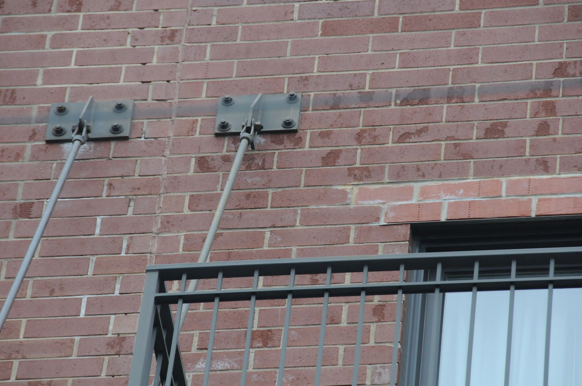 Failing balcony connection on brick building, Chicago