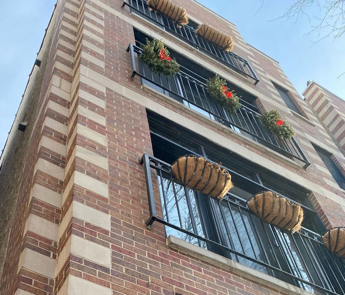 Juliette balconies contribute to leaking in brick building, Wicker Park