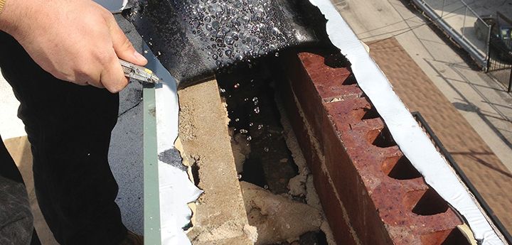 Concdensation dripping into brick and block parapet wall, Lakeview, Chicago