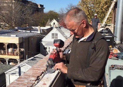 WickRight President Bob Kelly working on parapet wall