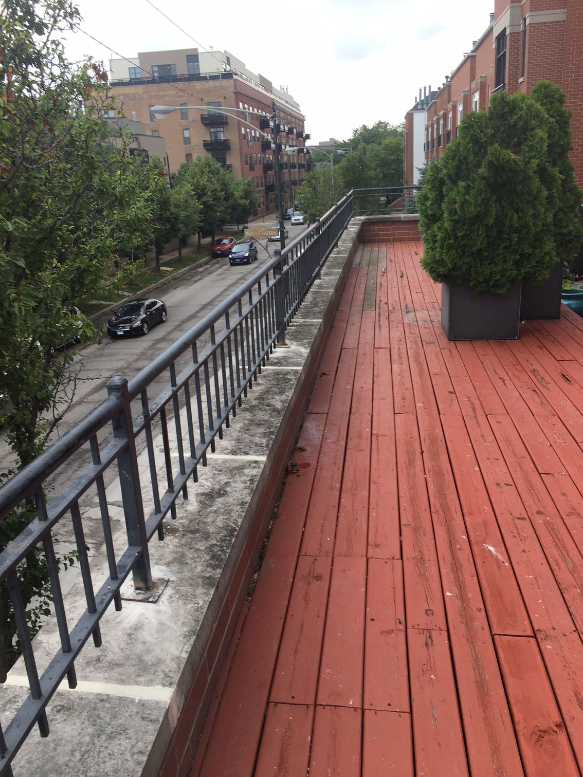 Parapet with limestone capstone with railings Chicago