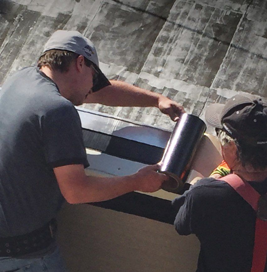 Drone shot of WickRight vented drip edge being installed on parapet