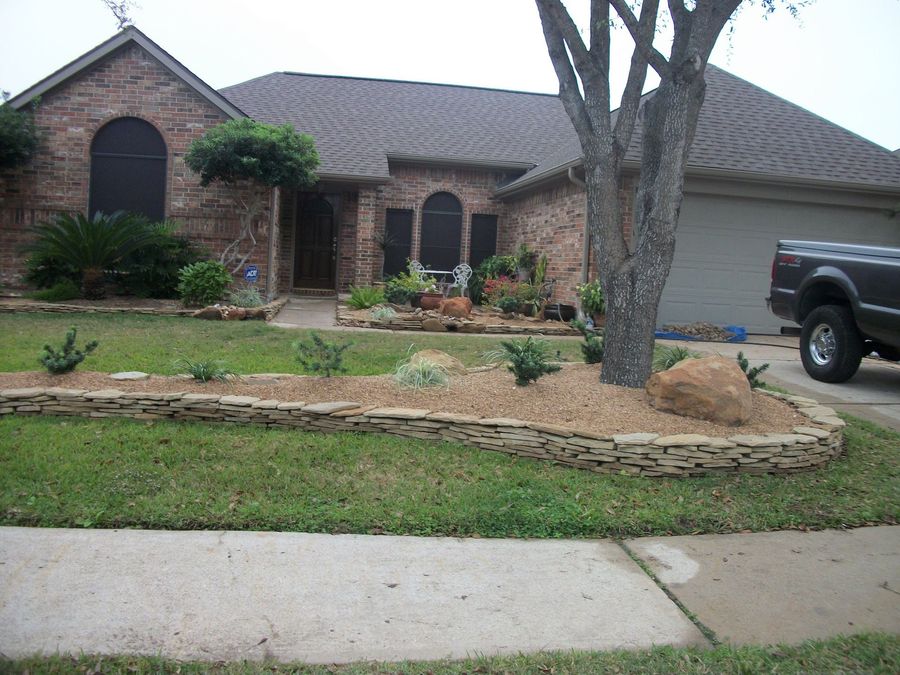 A truck is parked in front of a brick house
