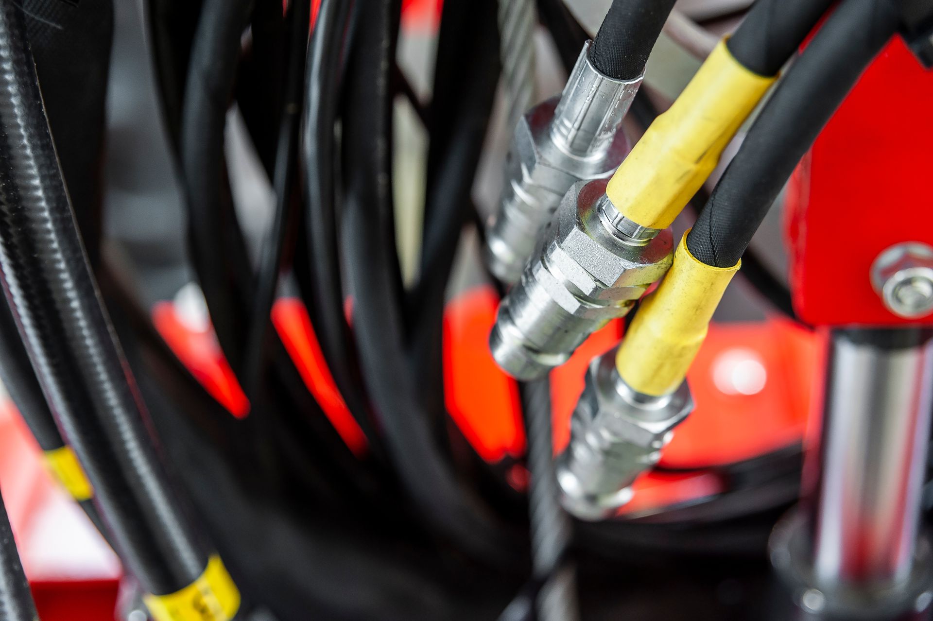 Close-up of high-pressure lines with valves. Industrial machine elements.