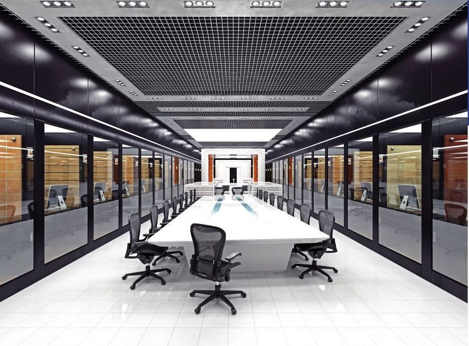 A large conference room with a long table and chairs