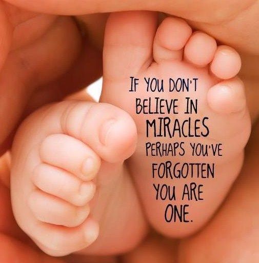 A baby 's foot with a quote on it