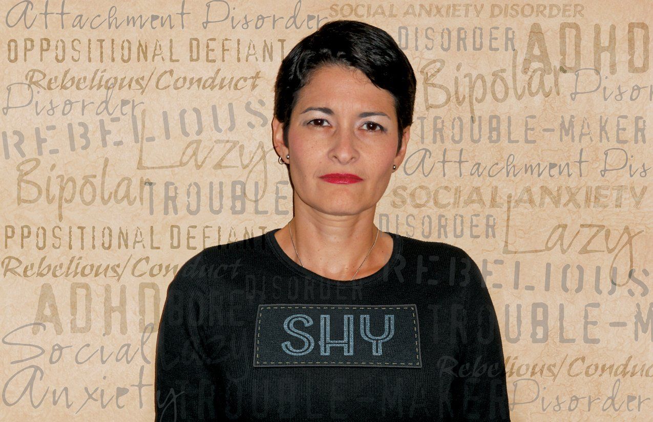 A woman wearing a black shirt with the word shy on it