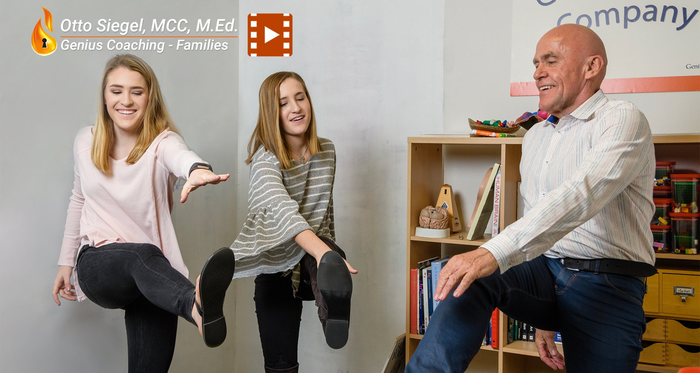 A man and two girls are doing exercises in a room.