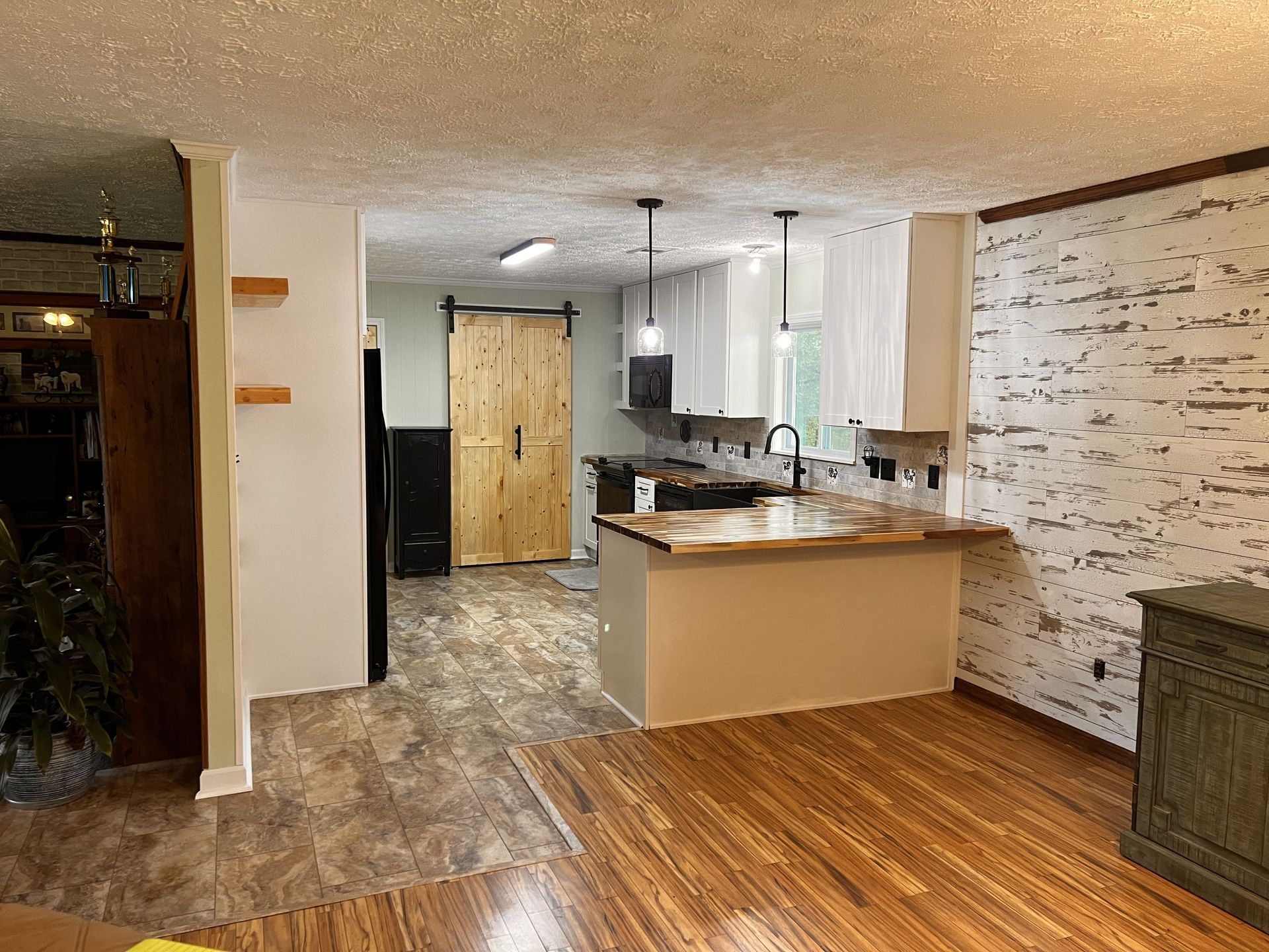 A kitchen with a large island and stools