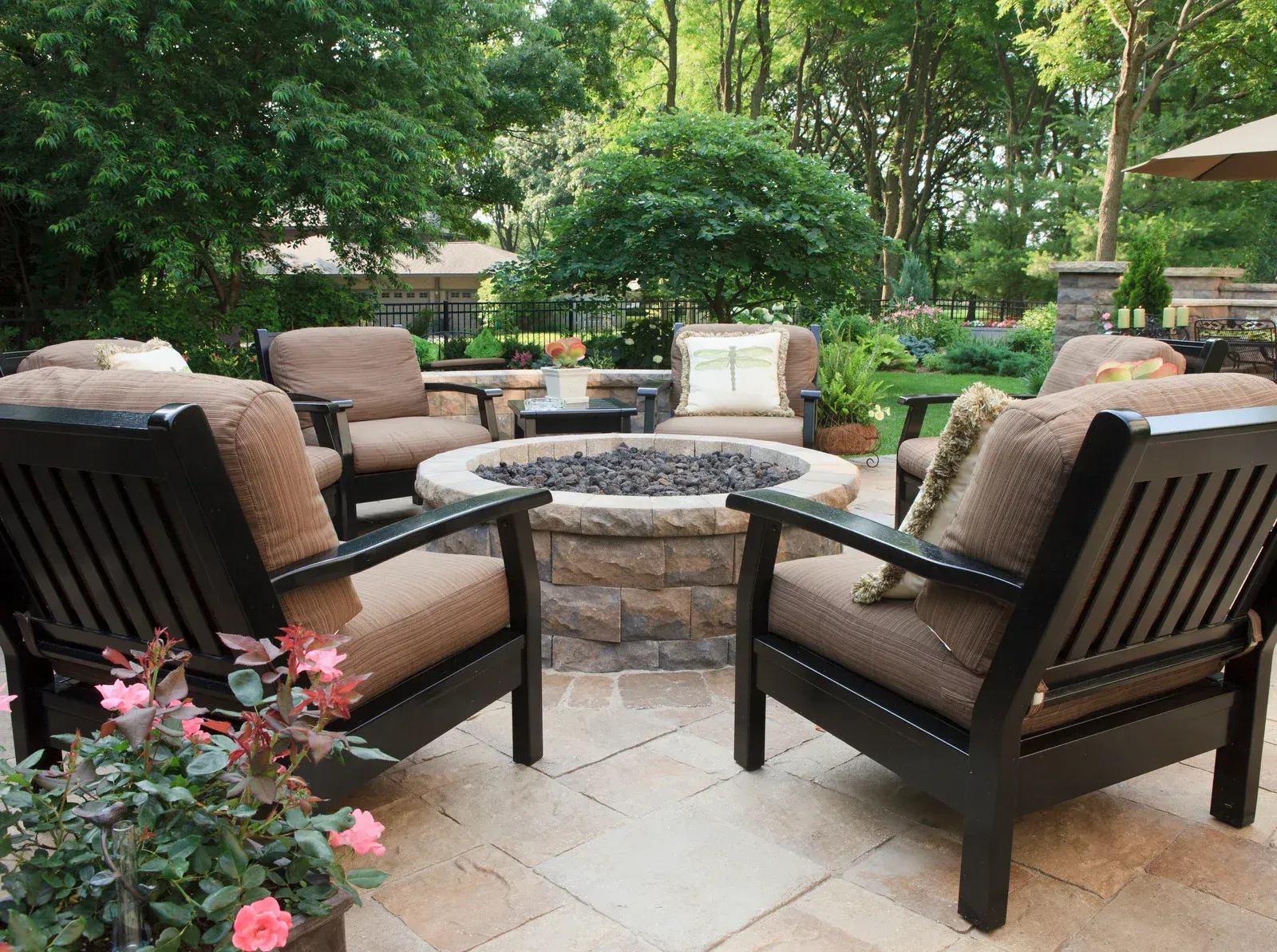 There is a fire pit in the middle of the patio.