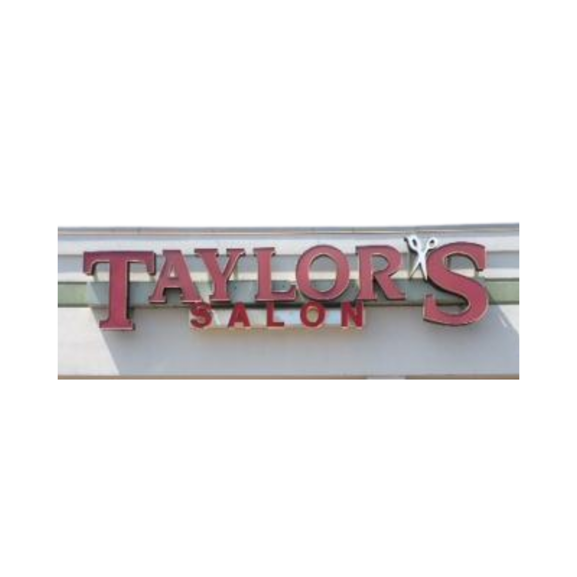 A sign for taylor 's salon is on the side of a building.