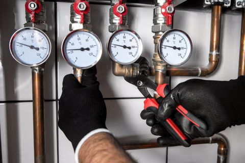 Plumber Fixing Central Heating System — Wet & Dry Plumbing & Gas in Toowoomba, QLD
