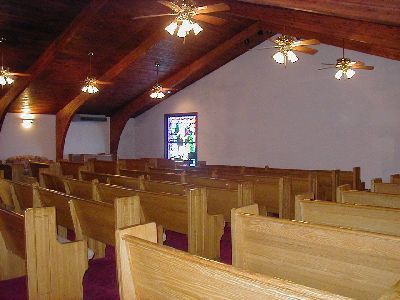 Chapel interior with pews and window