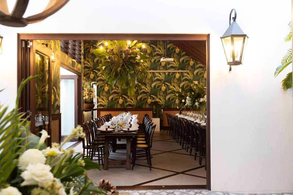 A large room with a table and chairs in it