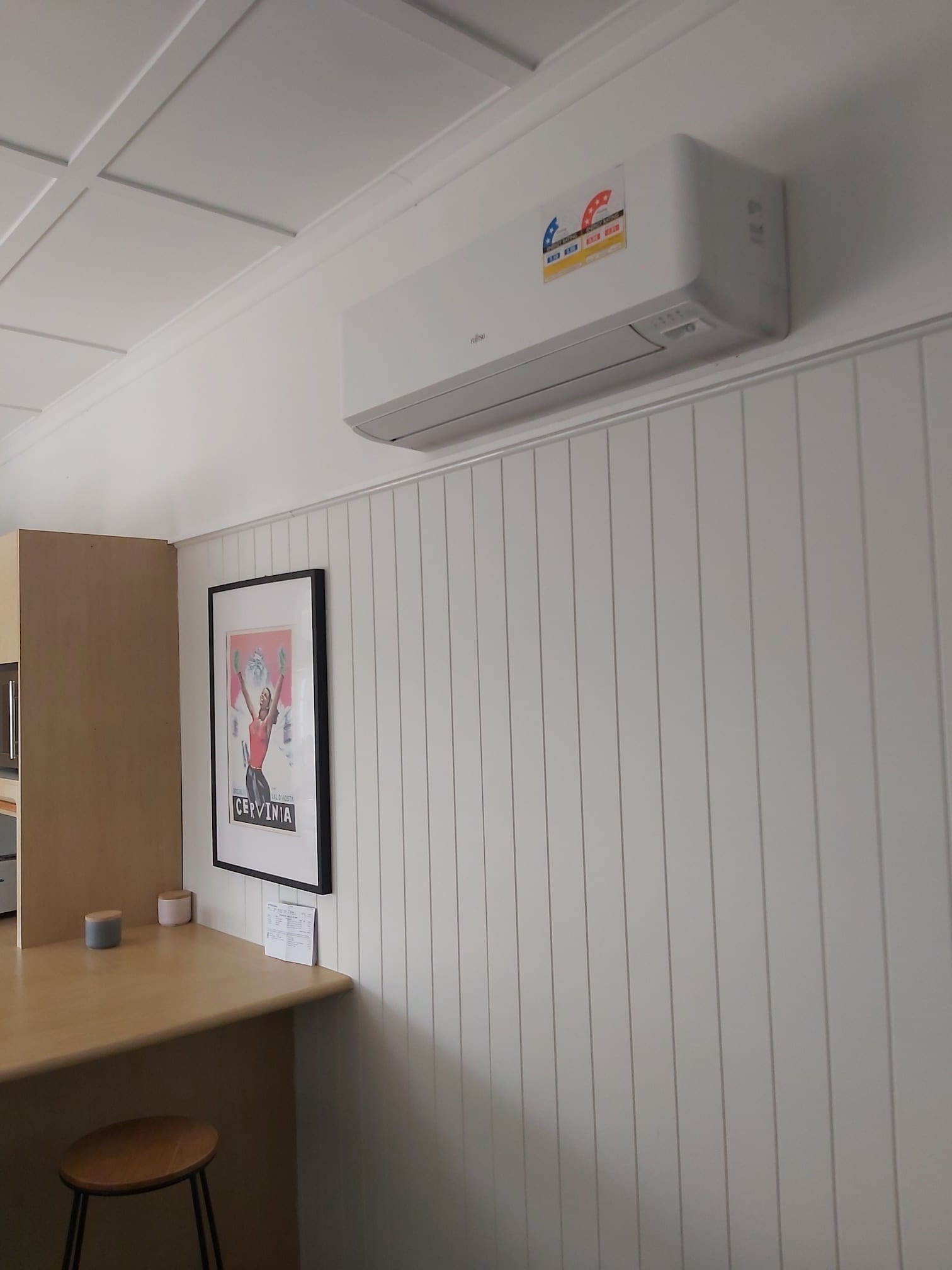 A white wall with a picture of a man on it