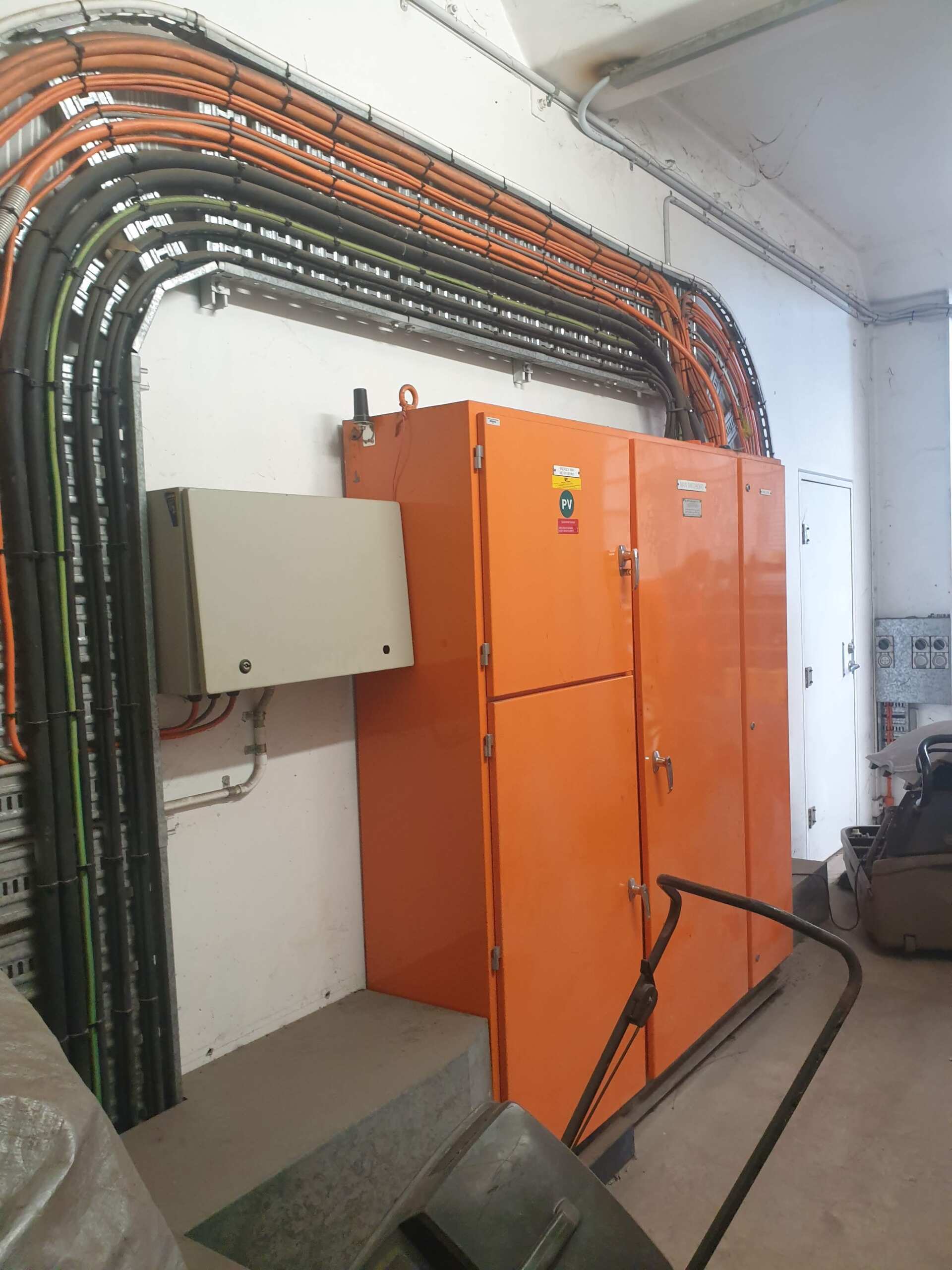 A room with a bunch of electrical boxes and wires