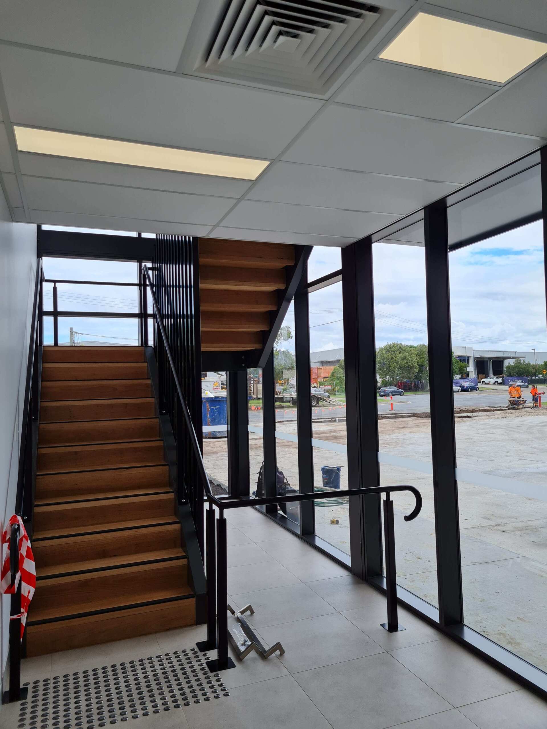 A staircase in a building with a lot of windows
