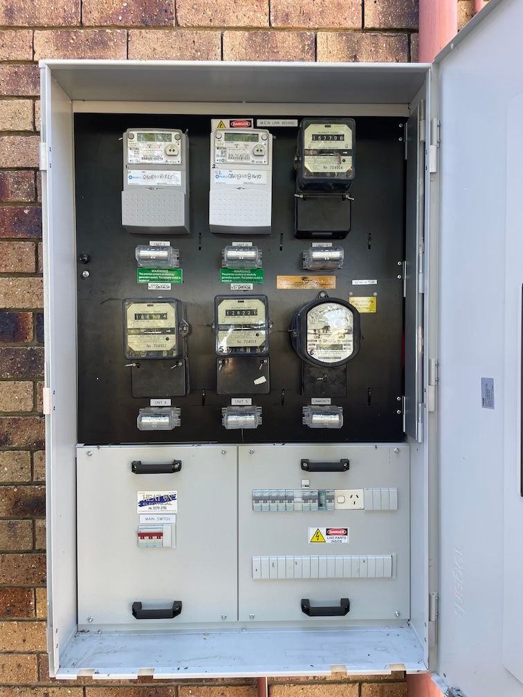 A box with a bunch of electrical meters inside of it