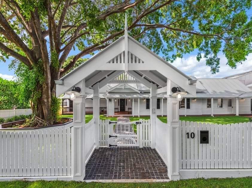 A white house with the number 10 on the front