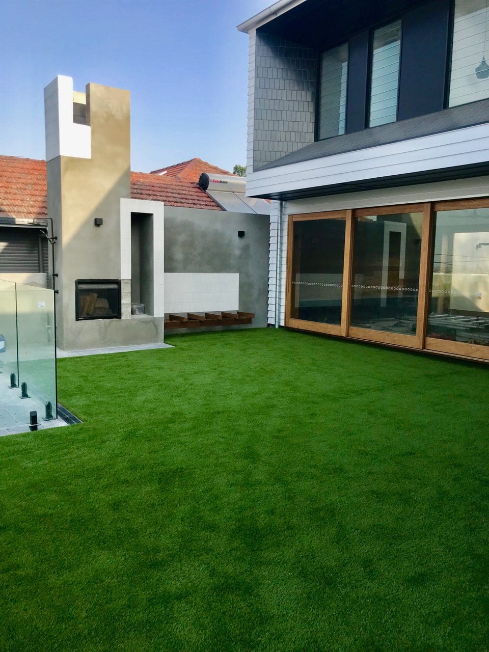 A large house with a large lawn in front of it