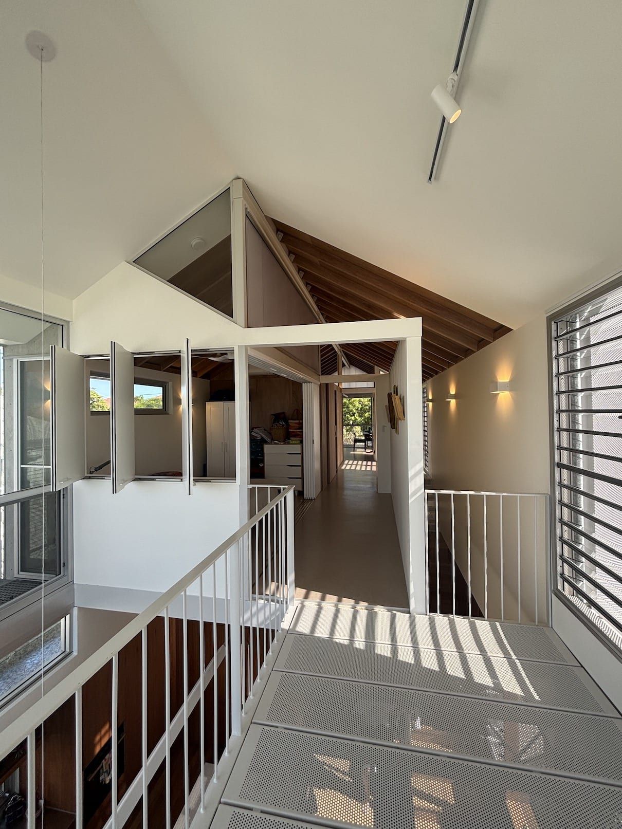 There is a staircase leading up to the second floor of a house.