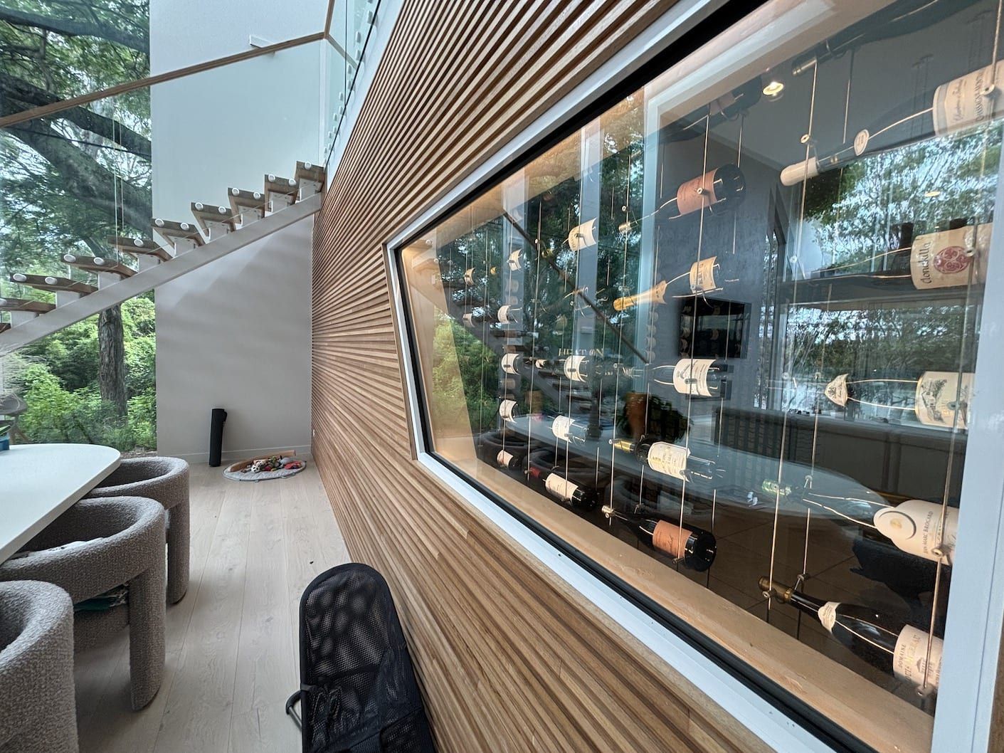 A wine cellar is built into the wall of a house.