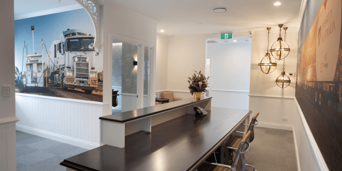 There is a long table in the middle of the room.