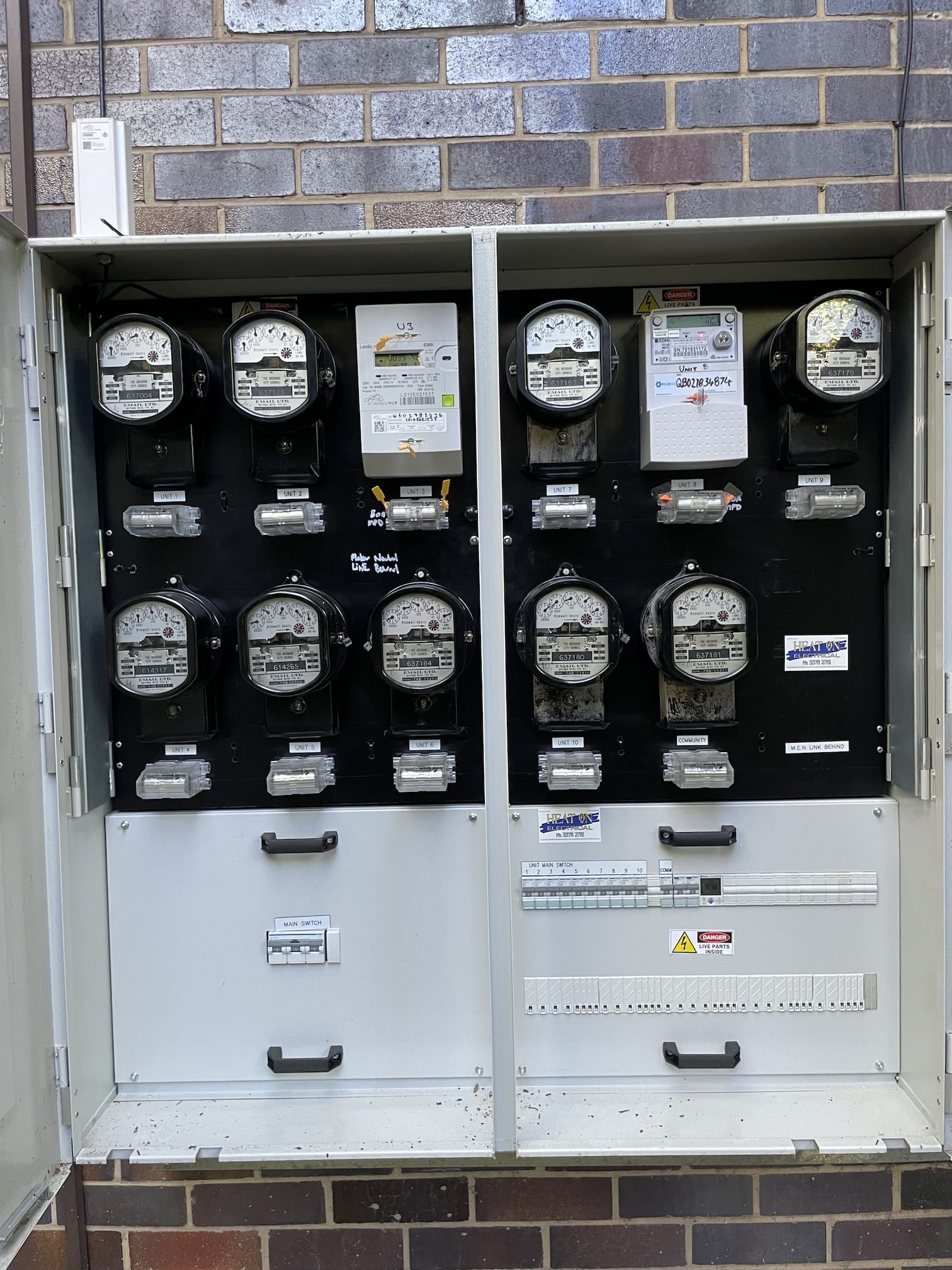 A box with a lot of electrical meters in it