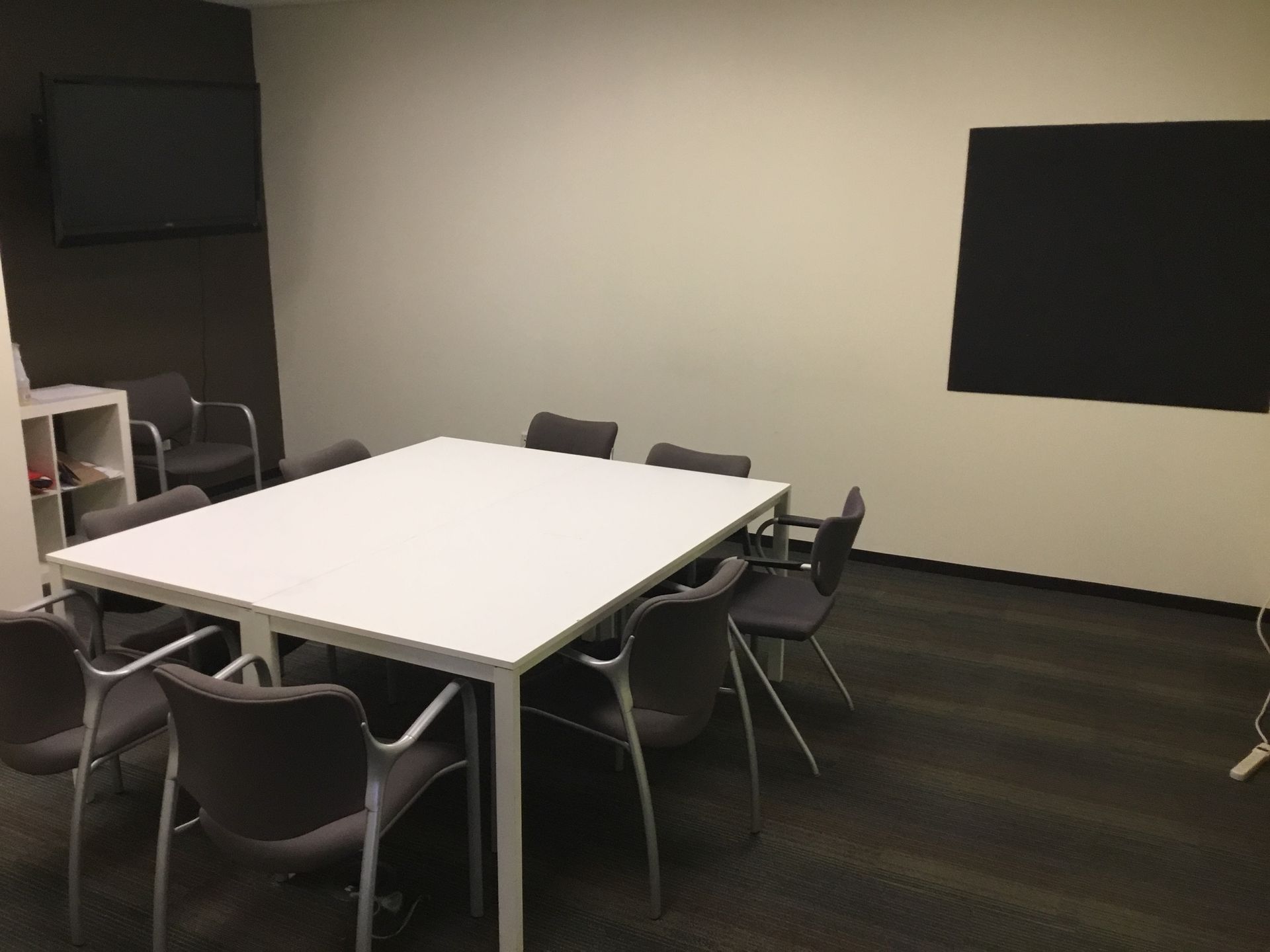 a conference room with a large table and chairs