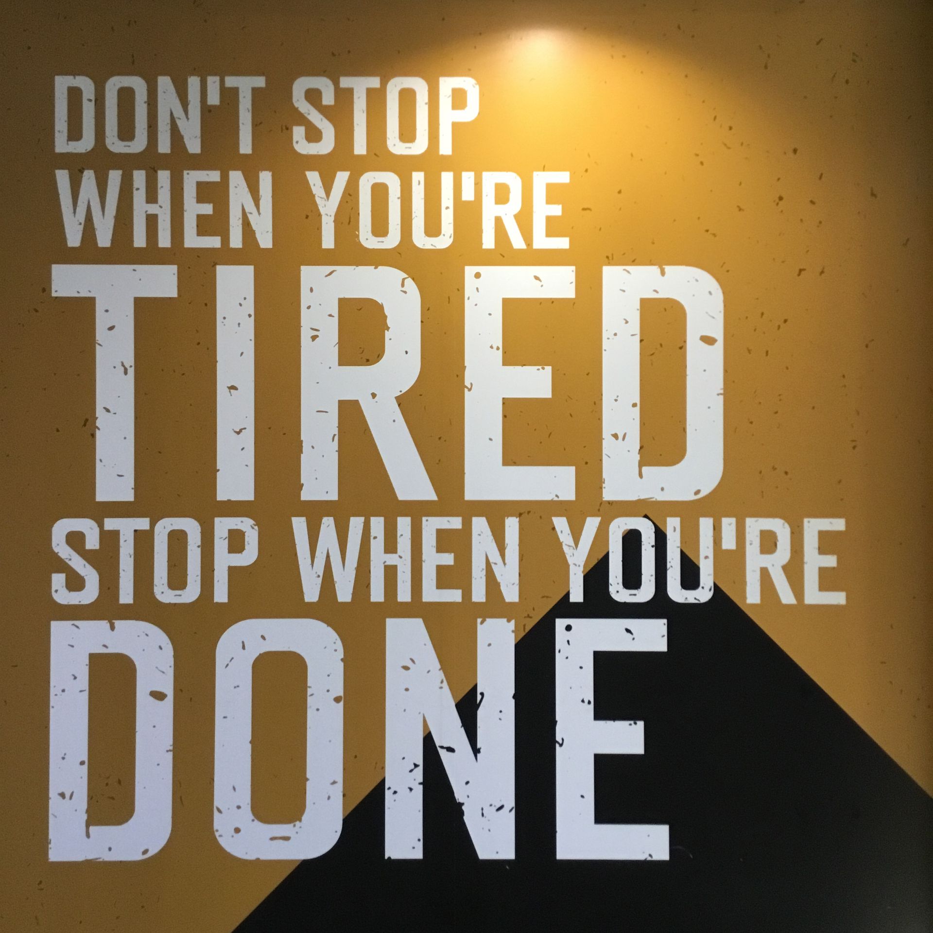 a poster that says do n't stop when you 're tired stop when you 're done
