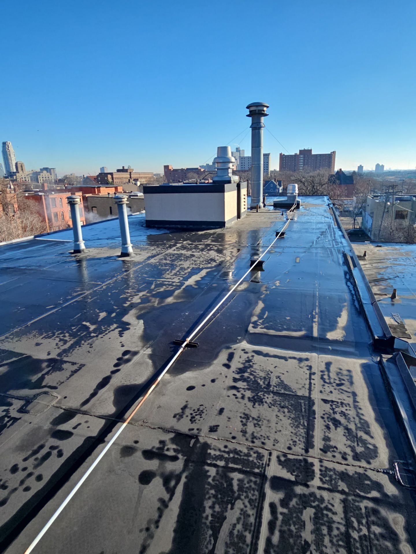 a house with a roof that has shingles on it and a window .