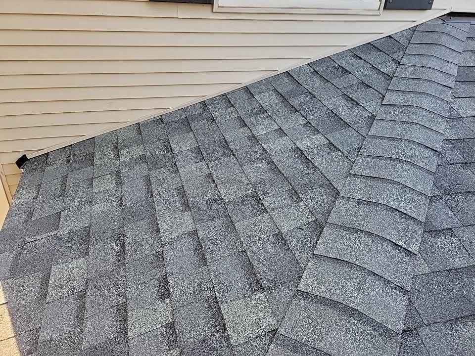 an aerial view of a roof with a brick chimney .