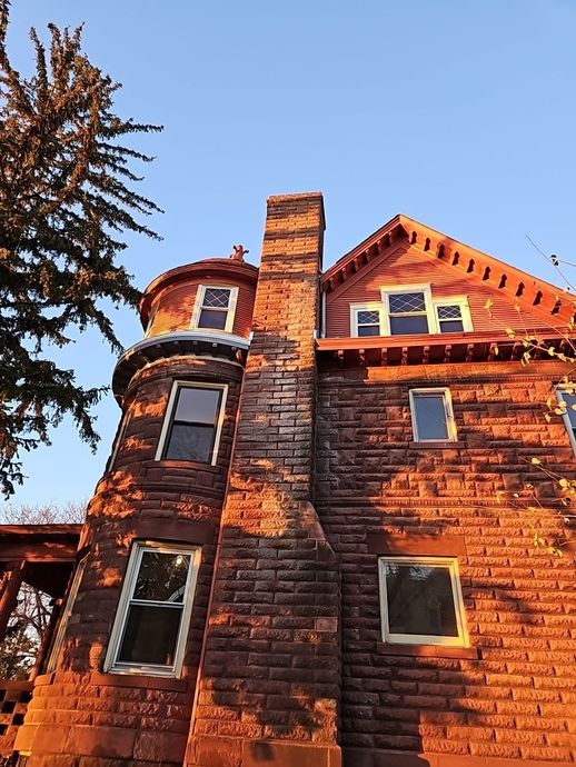 a large brick building with a chimney on top of it